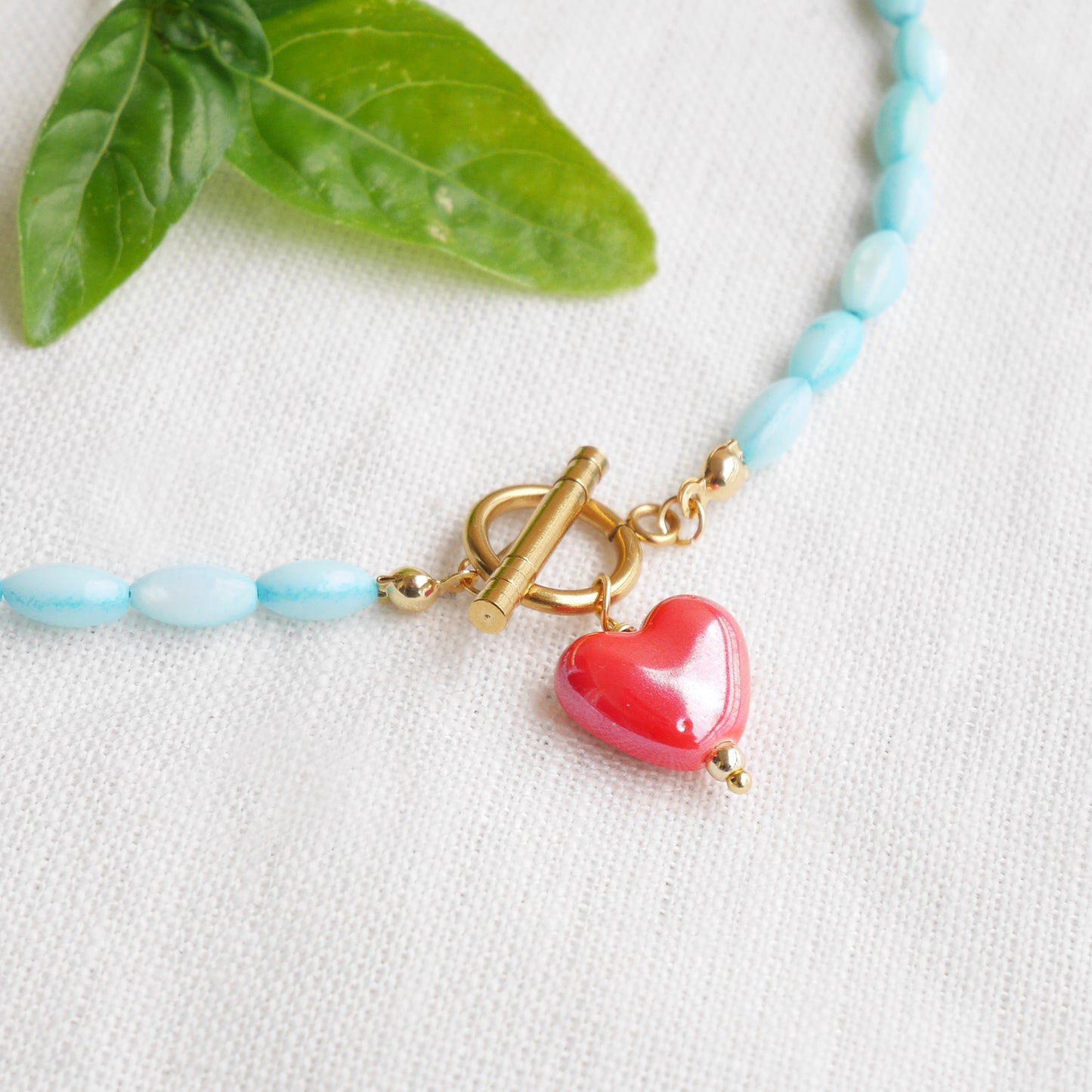 Turquoise shell bead necklace - red porcelain heart charm choker