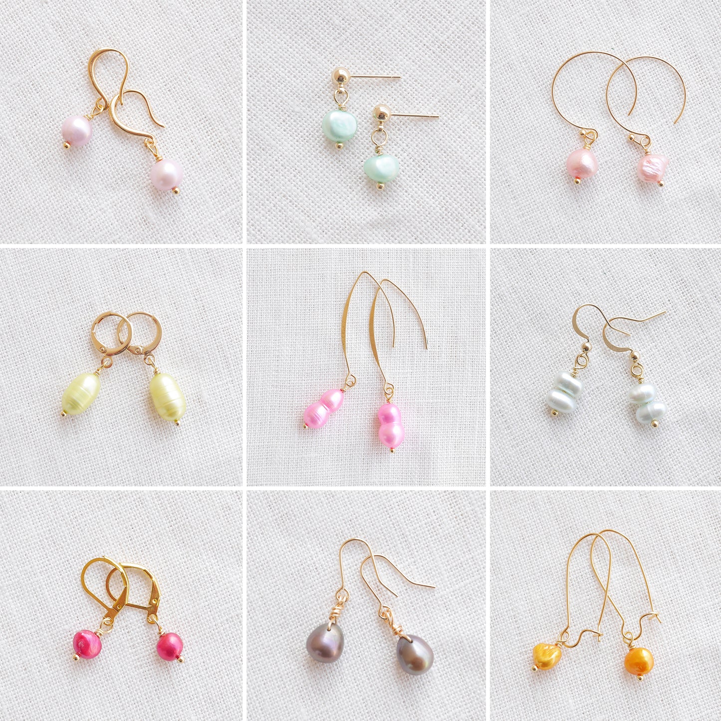 Nine pairs of colorful baroque freshwater pearl earrings on a white cloth.