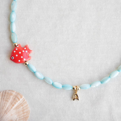 Colorful summer necklace – turquoise shell beads, red fish and bubble initial