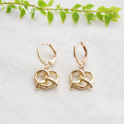 pretzel earrings on a white cloth.