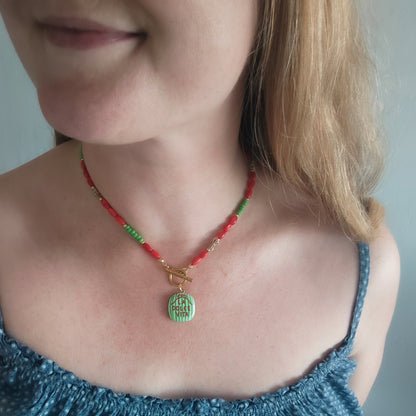 Woman wearing La dolce vita necklace.